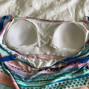 Pretty tankini top. No bottoms. Cute designs on it